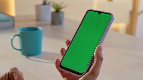 Woman Hands Swiping Chroma Key Smartphone Watching News Feed at Home Closeup