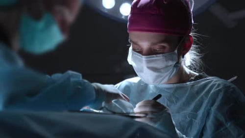 Surgeons Performing Operation in Hospital Operating Room