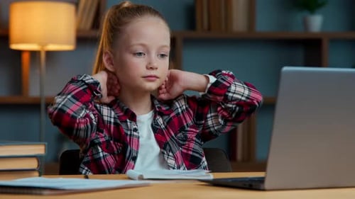 Focused Girl Learning Using Laptop in Cozy Room