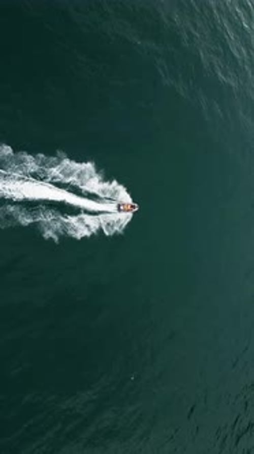 Aerial View Jet Ski in Sea White Water and Splashes in Sea Water Fast Speed Jet Ski Aerial View