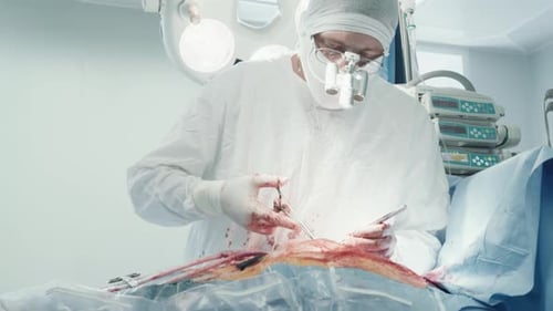 Surgeon Performs Surgery in Bright Operating Room