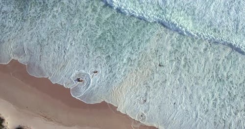 Aerial view, water waves and ocean at beach, sand and landscape of nature