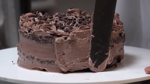 Delicious Chocolate Cake Being Frosted