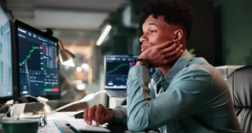 Business, man and tired of trading on computer at night with stock market statistics