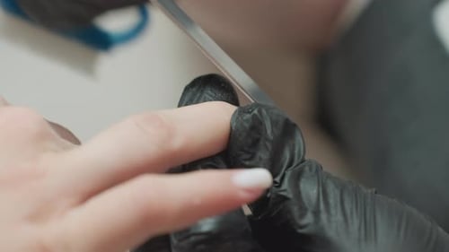 Close-up of Manicure Process with Nail File