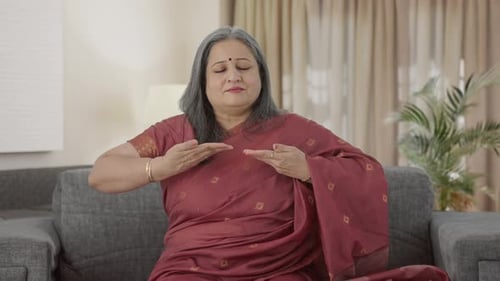 Mature Woman Practicing Mindful Meditation at Home