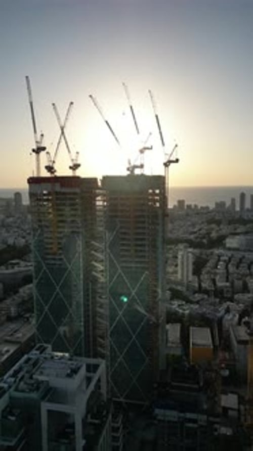 Aerial Shot Of Cityscape By Sea Against Sky At Sunset, Drone Descending Forward Over City - Tel Aviv