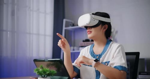 Woman Using VR Headset Interacting with Technology