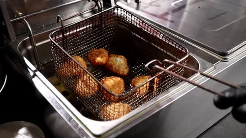 chef prepares delicious deep-fried dishes