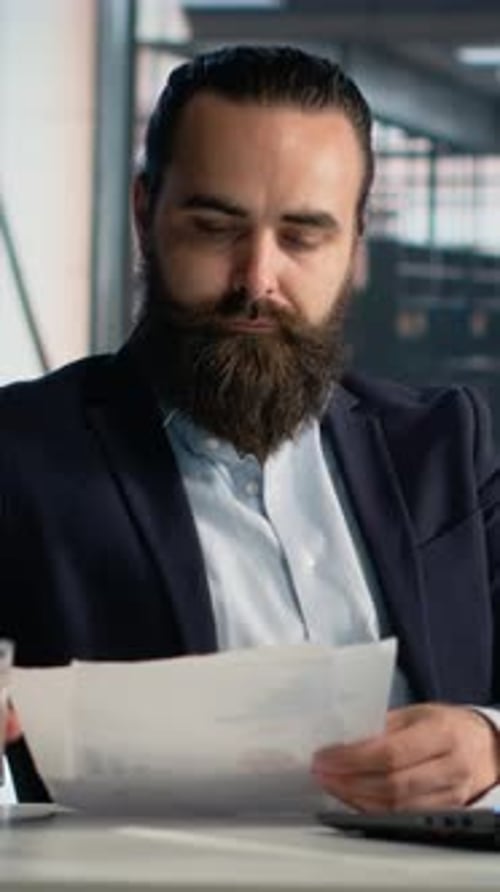 Vertical Video Business Professional with Documents KPIs Insights for Strategy Planning