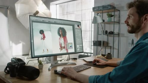 Professional Photographer Sitting at His Desk Uses Desktop Computer in a Photo Studio Retouches. Af