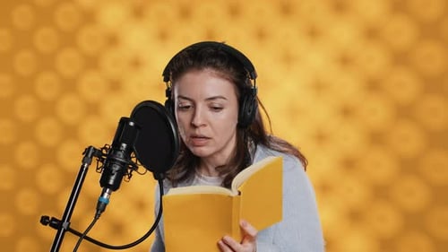 Woman Doing Voiceover Reading of Book to Produce Audiobook Studio Background