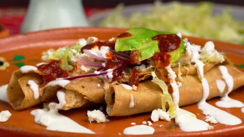 Delicious Plate of Rolled Tacos with Toppings