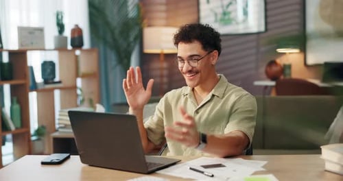 Man Video Chatting on Laptop at Home