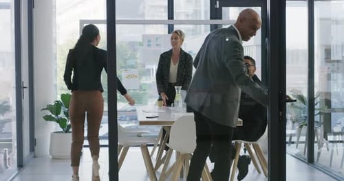4k video footage of a group of businesspeople shaking hands during a meeting in an office