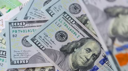 Closeup Examination of US Hundred Dollar Banknotes Showcasing Its Features