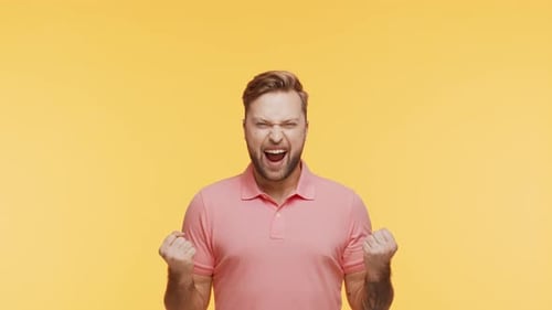 Expressive Young Man Over Vibrant Background Studio Portrait of Handsome Person