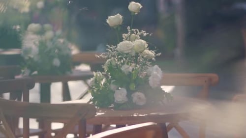 Elegant Floral Arrangements Adorn Wedding Tables Outdoors