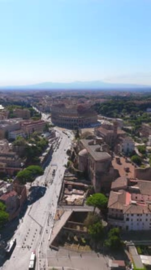 Aerial View of the Iconic Colosseum in the Heart of Rome Italy Showcasing Its Grandeur