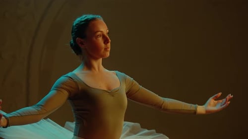 Beautiful Ballerina Rehearses on Theater Stage
