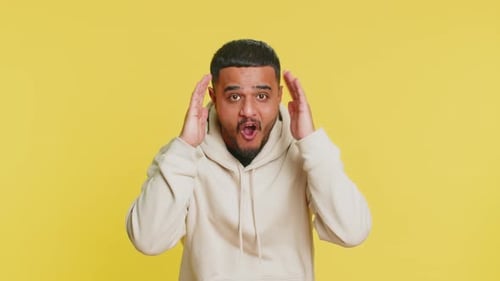 Young Adult's Emotional Reactions Against Yellow Background