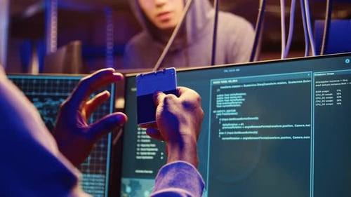 Hacker Holding SSD with Computer Exploit