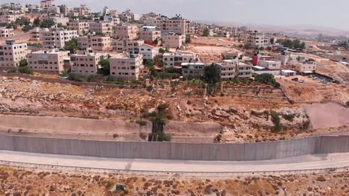 Aerial view over qalandiya refugee camp and the security wall