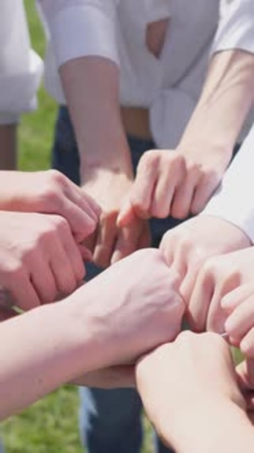 Teamwork Hands Together in Green Outdoors Space