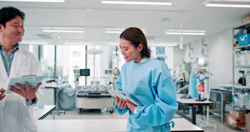 Medical Professionals Collaborating in Modern Laboratory Setting