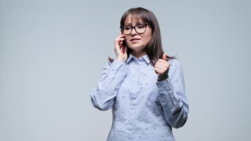 Woman Talking on Mobile Phone with Hand Gestures