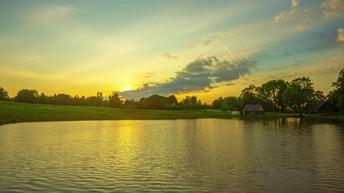 Beautiful Golden Sunrise Timelapse Over Farm Lake, Summer, Cloud Formations, Angelic