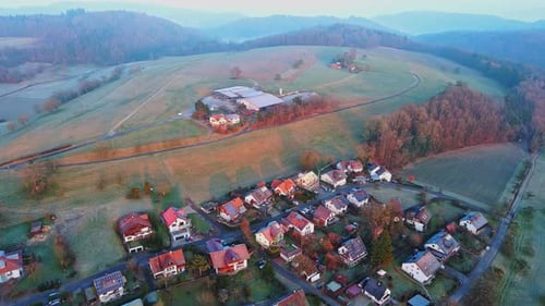 Village in Green Nature in the Hills Under the Rays of the Sun