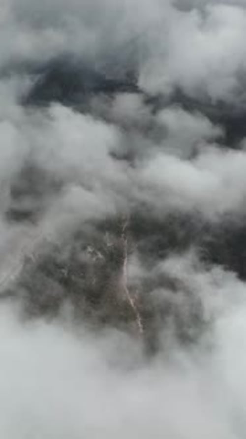 Vertical Video Cloudy Landscape in the Mountains Aerial View