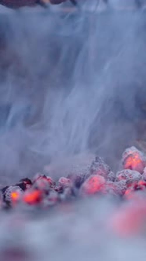 Lighten Wood Ash and Smoke Coming Out Extreme Close Up Shot