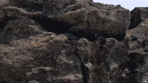 Coastal Rock Formation on Sunny Day