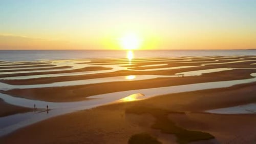 Cape Cod Bay Beach Aerial Drone Footage Sun Set at Low Tide During Golden Hour with People Walking