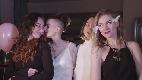 Four Stylish Women Posing at Birthday Party