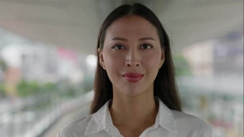 Portrait of the Young Charming Woman in Formal White Shirt and Beautiful Make Up Standing in Office