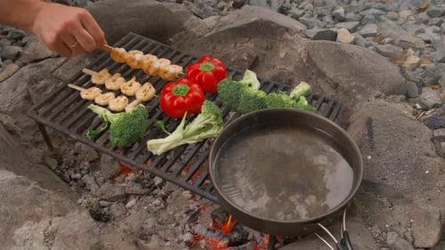 Fresh Shrimp and Vegetables Grilling Over Campfire