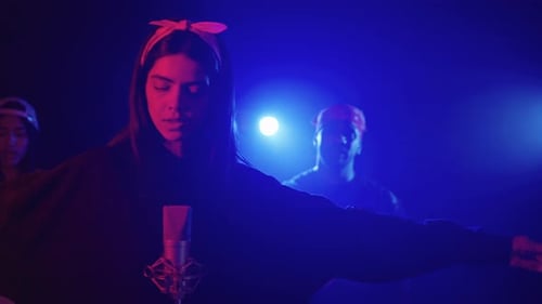 Young Singer Performing with Band in Slow Motion