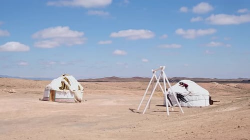 White Yurts in the Steppe Traditional Dwelling for Nomad People Children Play in the Open Air They