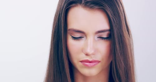 Smiling Woman with Brown Hair Blowing in the Wind