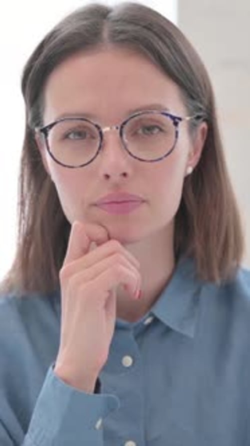 Portrait of Pensive Young Woman Thinking, Vertical Video