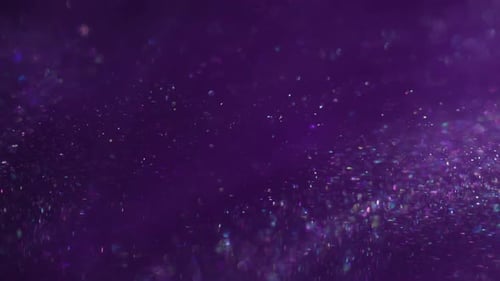 Floating Glitter Sparkles on Dreamy Purple Abstract Background