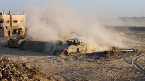 Israeli armored vehicle on the desert soil on war torn Gaza