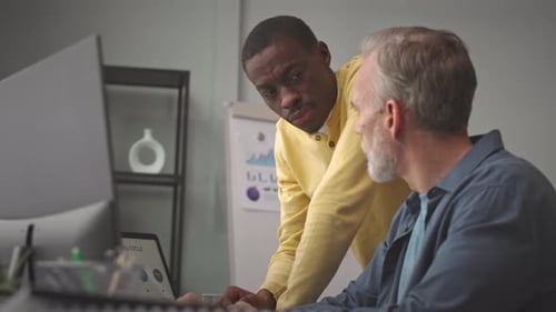 Colleagues Working on Business Presentation in Office