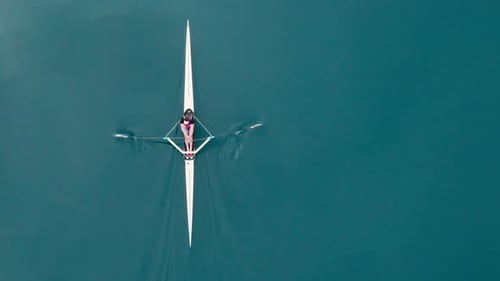 Rowing Top View of Professional Rower in Racing Boat Symbol of Strength Determination and Healthy