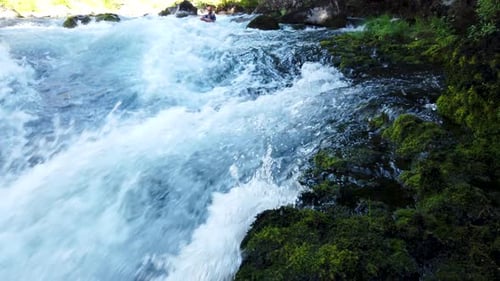 Kayaker Navigating Whitewater Rapids