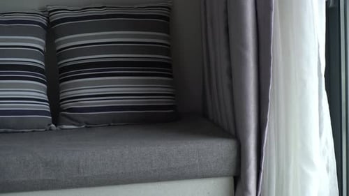 Modern Interior with Striped Pillows and Window