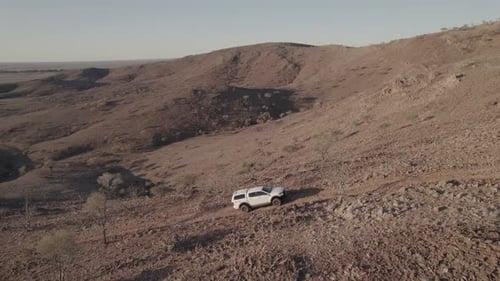 Climbing the side of a rugged hill in Outback Australia